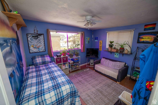 3724 S Carolyn St, Millcreek, UT 84106 - bedroom featuring baseboards, a ceiling fan, a textured ceiling, and wood finished floors