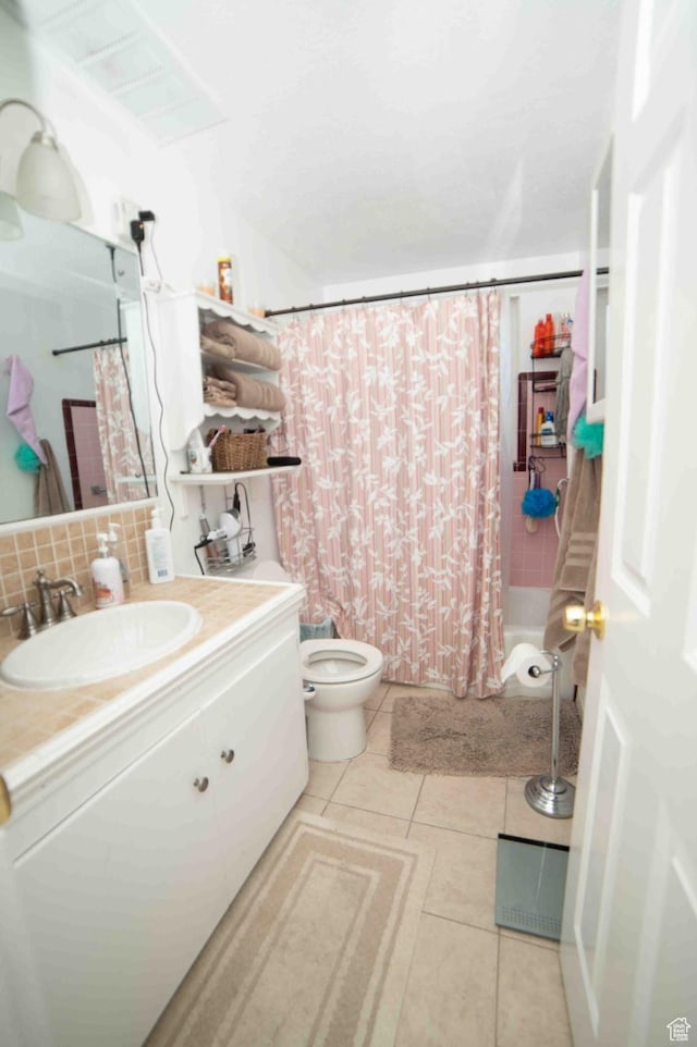 3724 S Carolyn St, Millcreek, UT 84106 - bathroom with tile patterned flooring, vanity, toilet, shower / tub combo, and tasteful backsplash