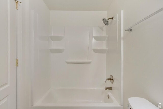 bathroom with toilet and shower / tub combination