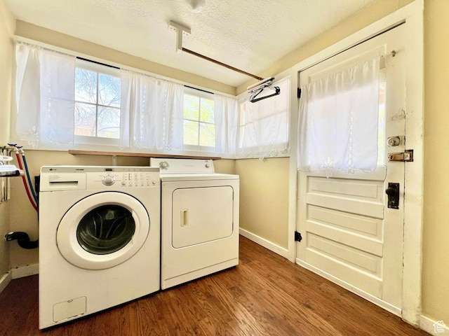 152 N 400 E, Vernal, UT 84078 - clothes washing area featuring laundry area, wood finished floors, baseboards, separate washer and dryer, and a textured ceiling