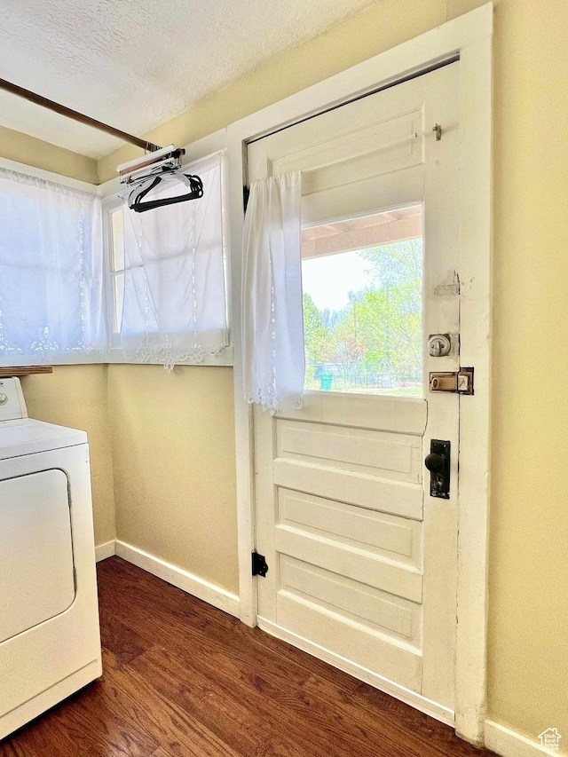 152 N 400 E, Vernal, UT 84078 - laundry area featuring dark wood finished floors, laundry area, washer / dryer, baseboards, and a textured ceiling
