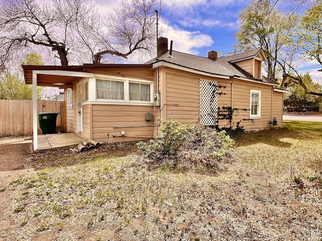 152 N 400 E, Vernal, UT 84078 - back of house featuring a chimney and fence
