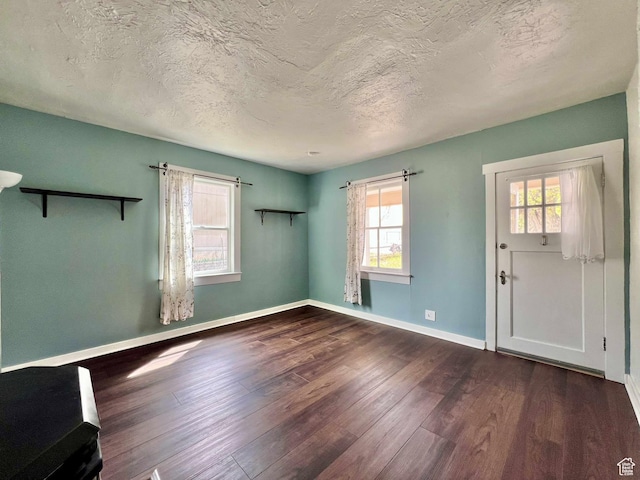 152 N 400 E, Vernal, UT 84078 - interior space featuring plenty of natural light, baseboards, wood finished floors, and a textured ceiling