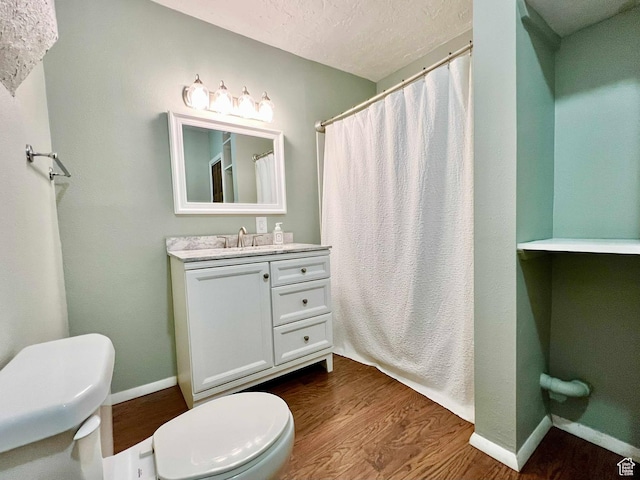 152 N 400 E, Vernal, UT 84078 - bathroom featuring baseboards, wood finished floors, and toilet