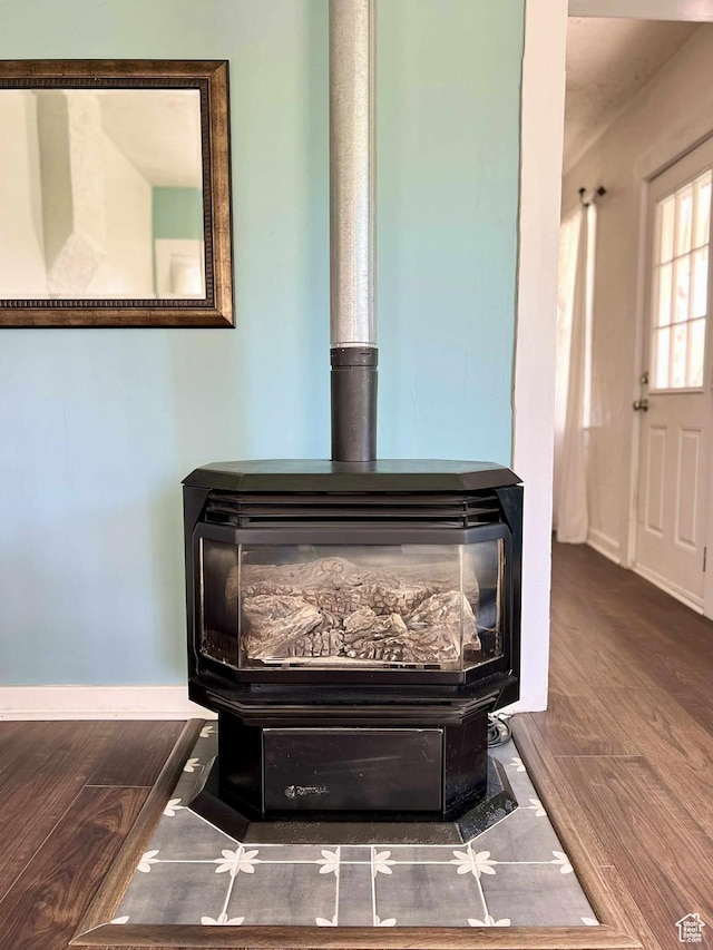 152 N 400 E, Vernal, UT 84078 - details featuring wood finished floors, a wood stove, and baseboards