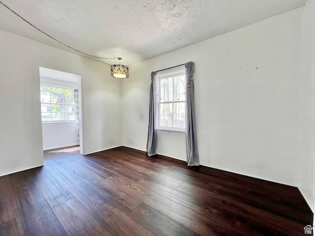 152 N 400 E, Vernal, UT 84078 - empty room with a textured ceiling and dark wood finished floors