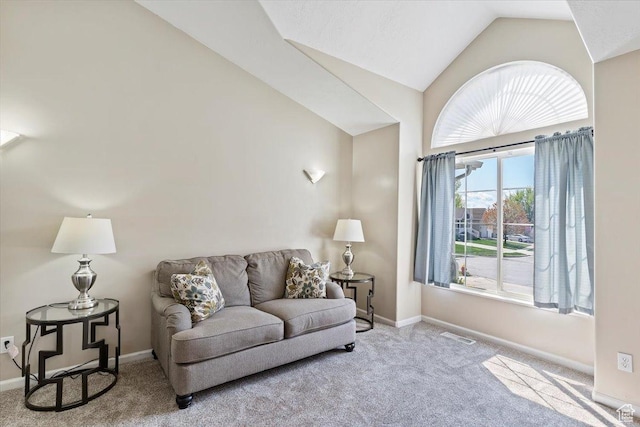 living room featuring visible vents, baseboards, vaulted ceiling, and carpet flooring