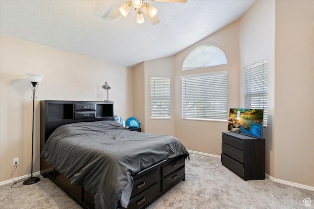 bedroom with ceiling fan, light carpet, lofted ceiling, and baseboards
