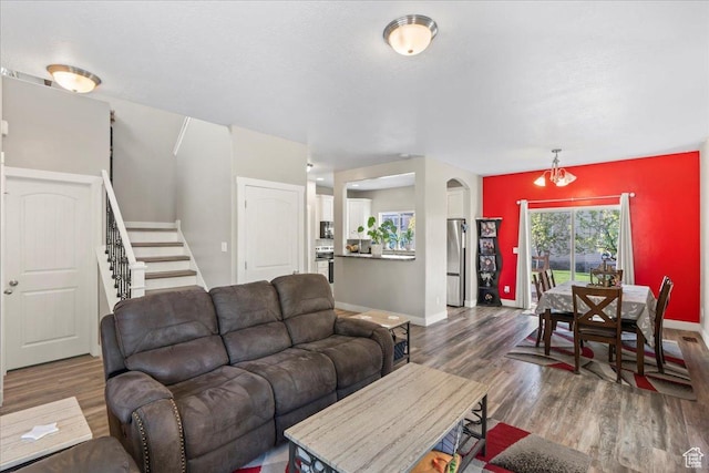 1521 W Kinloch Way, West Valley City, UT 84119 - living area featuring wood finished floors, stairs, and baseboards