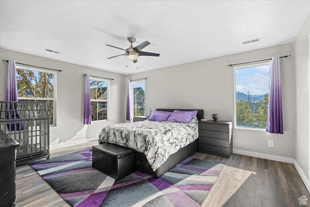 1521 W Kinloch Way, West Valley City, UT 84119 - bedroom with wood finished floors, visible vents, a ceiling fan, and baseboards