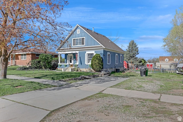 453 N 200 W, Brigham City, UT 84302 - bungalow-style home with a front lawn, fence, and covered porch