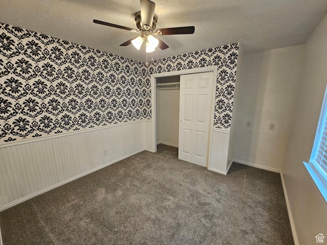 723 E 200 N, Orem, UT 84097 - unfurnished bedroom with carpet floors, a textured ceiling, and wallpapered walls