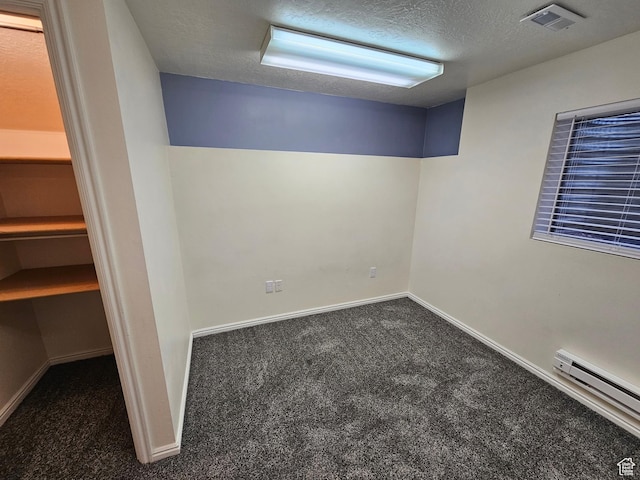 723 E 200 N, Orem, UT 84097 - basement featuring baseboard heating, a textured ceiling, carpet, baseboards, and visible vents