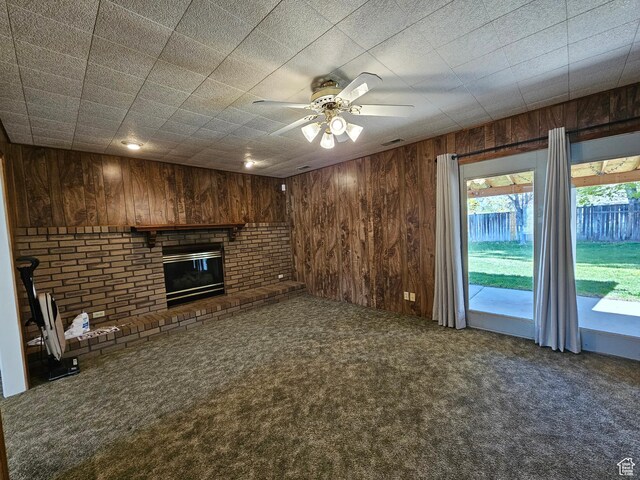 723 E 200 N, Orem, UT 84097 - unfurnished living room featuring visible vents, wood walls, a fireplace, ceiling fan, and carpet
