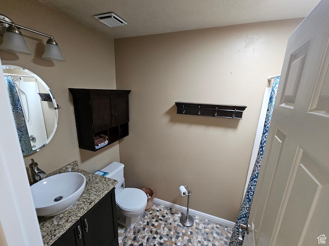 723 E 200 N, Orem, UT 84097 - bathroom with baseboards, visible vents, toilet, and vanity