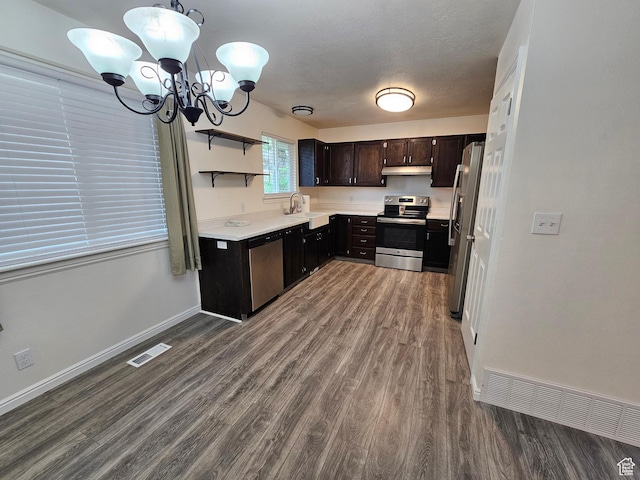 723 E 200 N, Orem, UT 84097 - kitchen with appliances with stainless steel finishes, a sink, an inviting chandelier, and wood finished floors