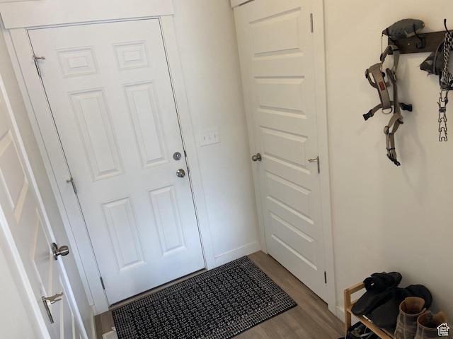 9372 N Scenic Mountain Dr W, Eagle Mountain, UT 84005 - doorway to outside with baseboards and dark wood-type flooring