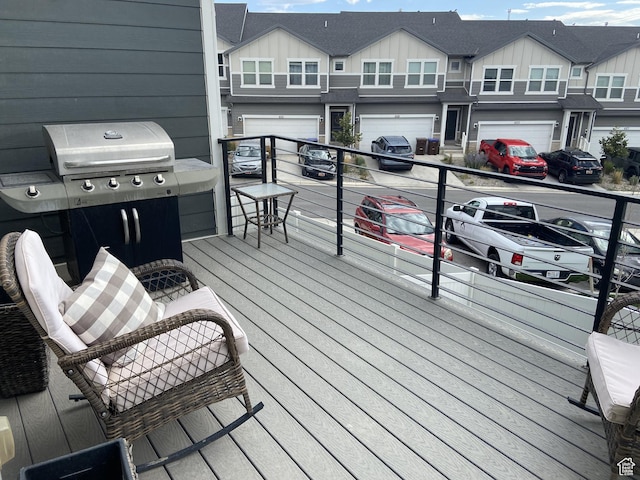 9372 N Scenic Mountain Dr W, Eagle Mountain, UT 84005 - wooden terrace featuring an attached garage and driveway