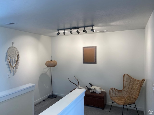 9372 N Scenic Mountain Dr W, Eagle Mountain, UT 84005 - sitting room featuring baseboards, track lighting, visible vents, and light colored carpet