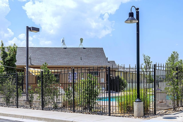 view of gate with fence