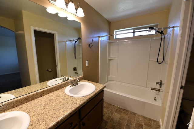 bathroom with a sink, double vanity, and tub / shower combination