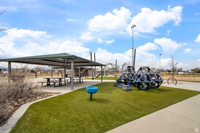 view of property's community with a gazebo and a yard