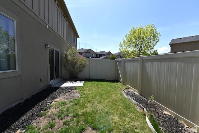 view of yard with a fenced backyard