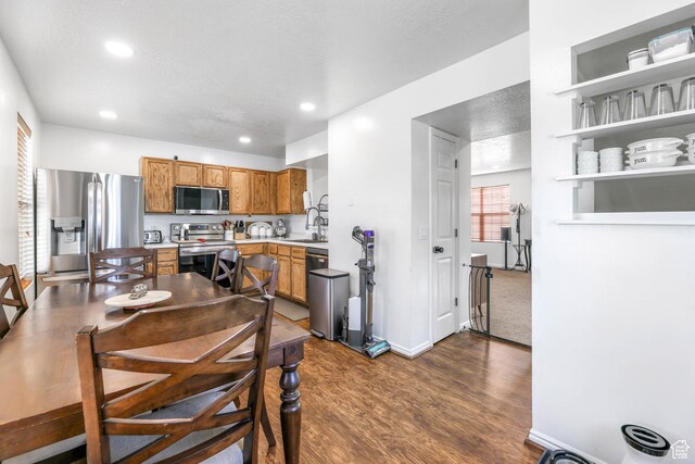 734 N 170 W, Tooele, UT 84074 - dining room featuring baseboards, dark wood-style floors, and recessed lighting