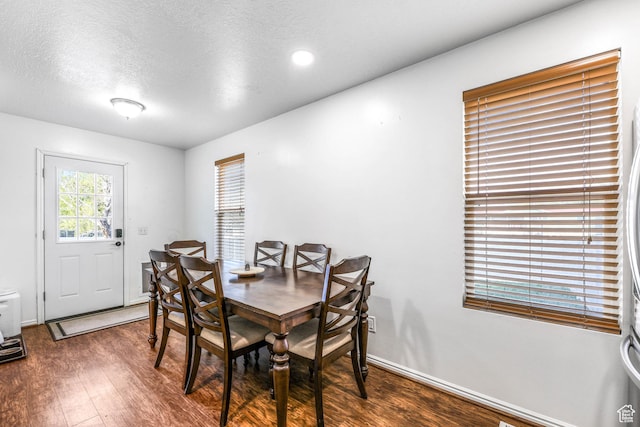 734 N 170 W, Tooele, UT 84074 - dining space featuring baseboards, wood finished floors, and a textured ceiling