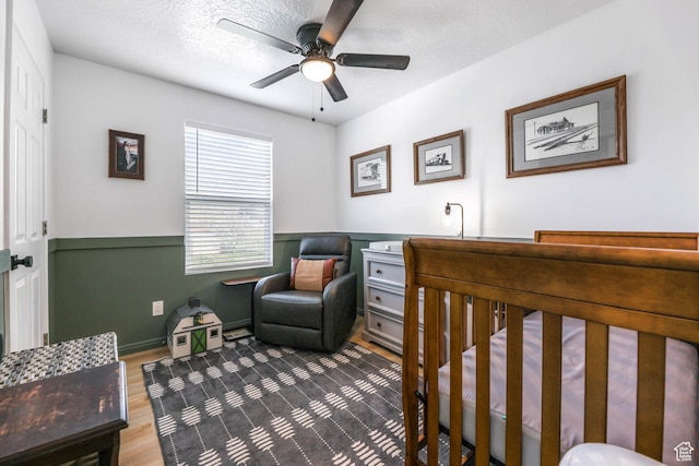 734 N 170 W, Tooele, UT 84074 - bedroom with wainscoting, wood finished floors, and ceiling fan