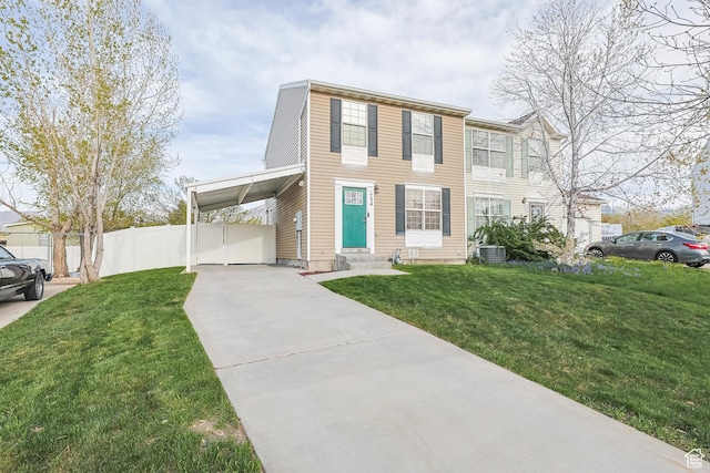 734 N 170 W, Tooele, UT 84074 - view of front of home featuring concrete driveway, fence, cooling unit, entry steps, and a front yard
