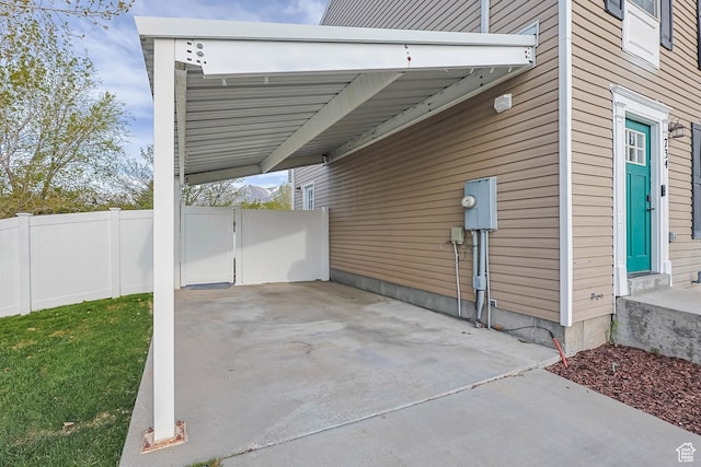 734 N 170 W, Tooele, UT 84074 - view of patio / terrace featuring a carport and fence