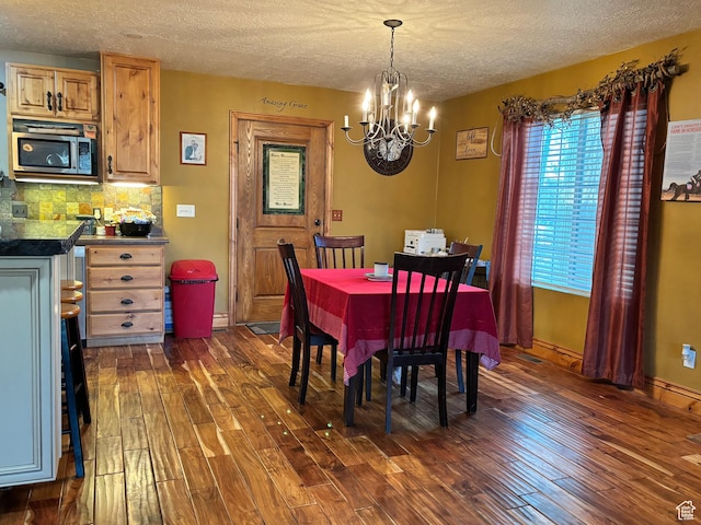 9762 S 3350 W, Payson, UT 84651 - dining area with dark wood-style floors, a textured ceiling, and a notable chandelier
