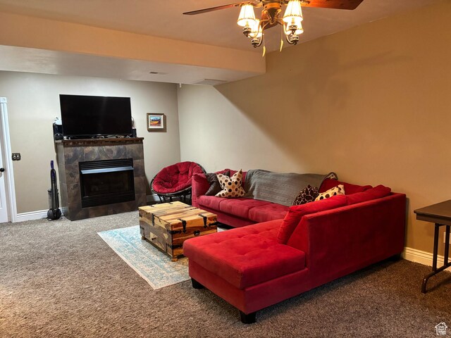 9762 S 3350 W, Payson, UT 84651 - living area with a tile fireplace, carpet flooring, a ceiling fan, and baseboards