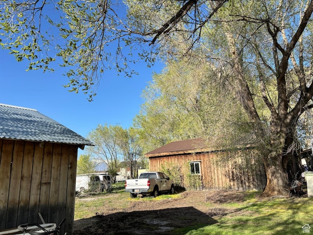 9762 S 3350 W, Payson, UT 84651 - view of home's exterior featuring board and batten siding and an outdoor structure