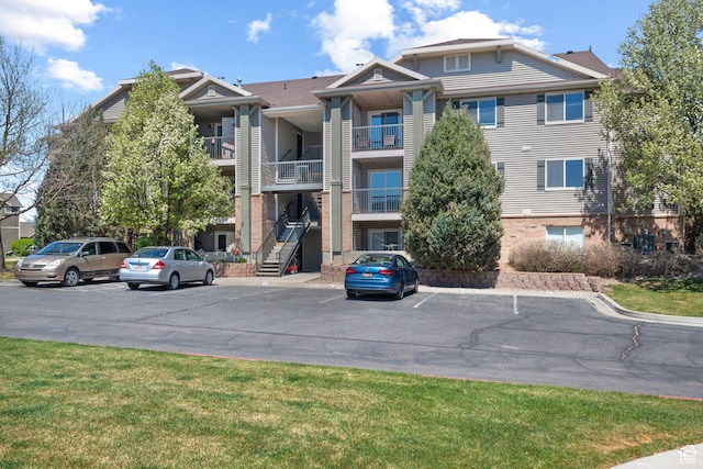 view of property with uncovered parking