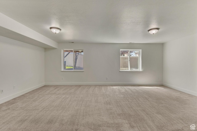 2074 S Orchard Dr, Bountiful, UT 84010 - spare room with a textured ceiling, baseboards, and light carpet