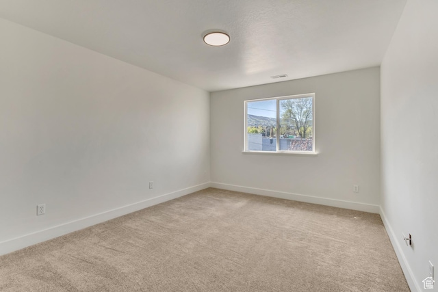 2074 S Orchard Dr, Bountiful, UT 84010 - spare room featuring visible vents, baseboards, and light colored carpet