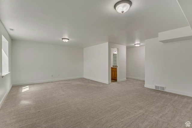 2074 S Orchard Dr, Bountiful, UT 84010 - empty room with baseboards, visible vents, and light colored carpet