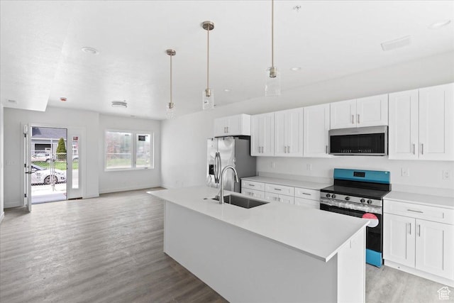 805 S 800 W Unit D, Salt Lake City, UT 84104 - kitchen featuring light wood finished floors, stainless steel appliances, white cabinets, and a sink