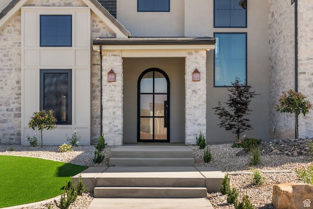 3382 E Ezra Ln, St George, UT 84790 - view of exterior entry featuring stucco siding and stone siding