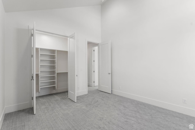 3382 E Ezra Ln, St George, UT 84790 - unfurnished bedroom featuring high vaulted ceiling, a closet, a spacious closet, baseboards, and carpet flooring