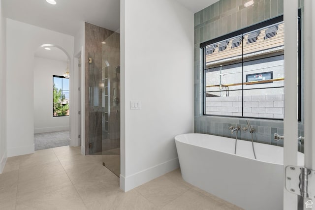 3382 E Ezra Ln, St George, UT 84790 - full bath with tile patterned floors, baseboards, a freestanding bath, and a stall shower
