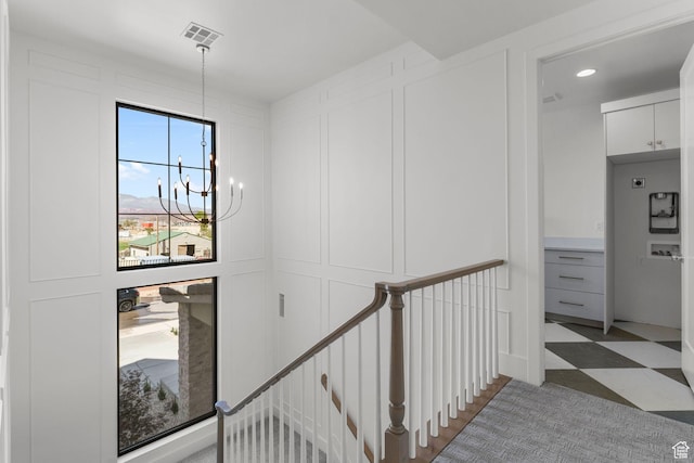 3382 E Ezra Ln, St George, UT 84790 - corridor with recessed lighting, an inviting chandelier, light floors, visible vents, and an upstairs landing