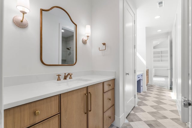 3382 E Ezra Ln, St George, UT 84790 - bathroom with walk in shower, visible vents, tile patterned floors, and vanity