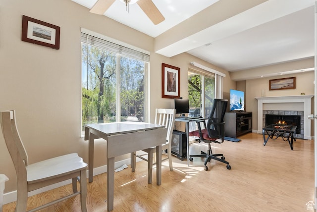 5552 S Willow Ln E Unit C, Salt Lake City, UT 84107 - office space featuring baseboards, a tile fireplace, wood finished floors, and ceiling fan