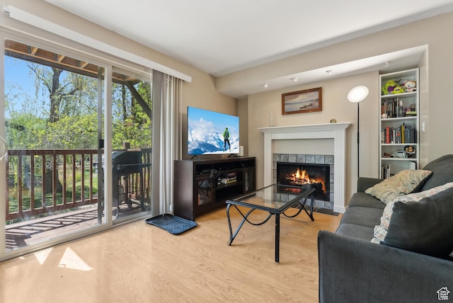 5552 S Willow Ln E Unit C, Salt Lake City, UT 84107 - living area with wood finished floors and a tile fireplace
