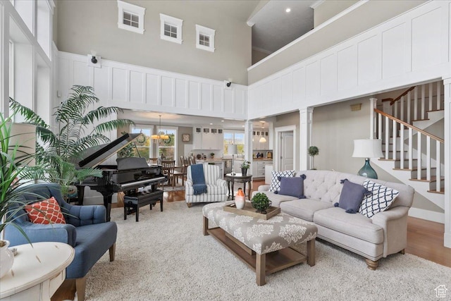 13379 S Elda Rae Cir W, Riverton, UT 84065 - living area featuring a towering ceiling and stairway