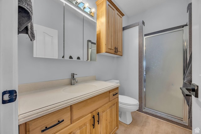 1563 Bryan Rd, Erda, UT 84074 - bathroom with a shower stall, toilet, vanity, and wood finished floors