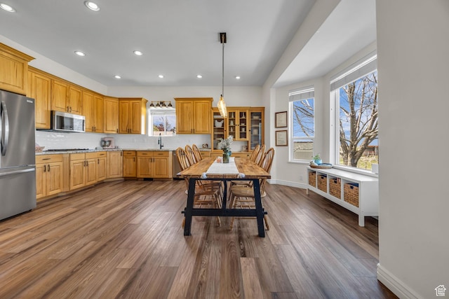 1563 Bryan Rd, Erda, UT 84074 - kitchen featuring stainless steel appliances, baseboards, recessed lighting, and a wealth of natural light